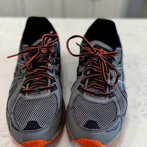 Mens Asics size 11 Tennis shoes; Black, grey, with orange Accents